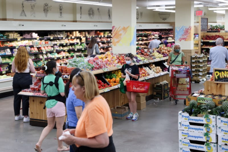 FILE PHOTO: People shop in a supermarket as inflation affected consumer prices in Manhattan, New York City