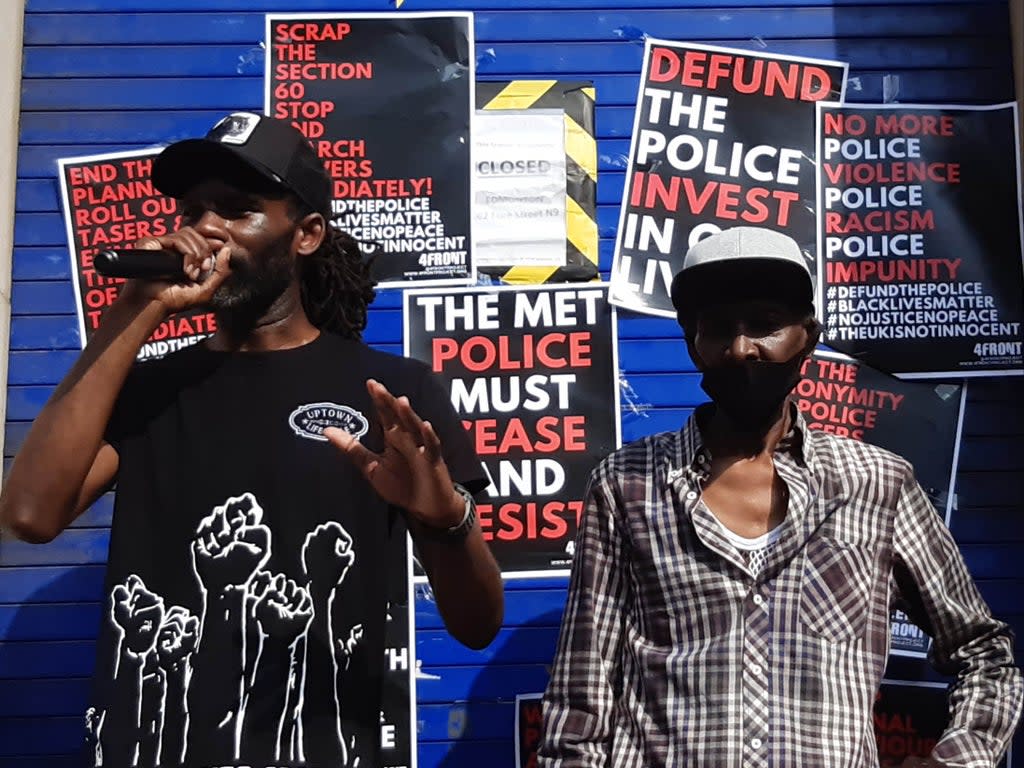 Rapper Wretch 32 (left) and his father Millard Scott, who was Tasered by police at his home in north London (PA)