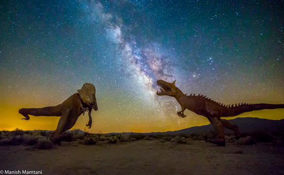 The dazzling Milky Way serves as a stunning backdrop to two dinosaur statues locked in a battle pose at Borrego Springs, California in this photo captured by night sky photographer Manish Mamtani.