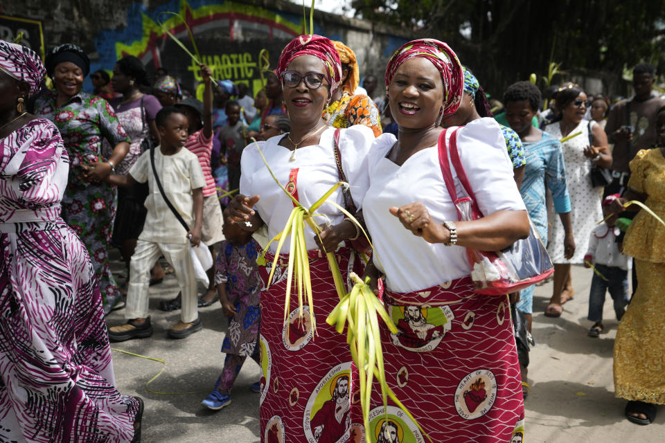 Catholic faithfuls march carrying Palm fronds to commemorate Palm Sunday, which marks the entry of Jesus Christ into Jerusalem, on the streets of Lagos, Nigeria, Sunday, April 2, 2023. The ceremony marks the beginning of the Holy Week leading to Easter. (AP Photo/Sunday Alamba)