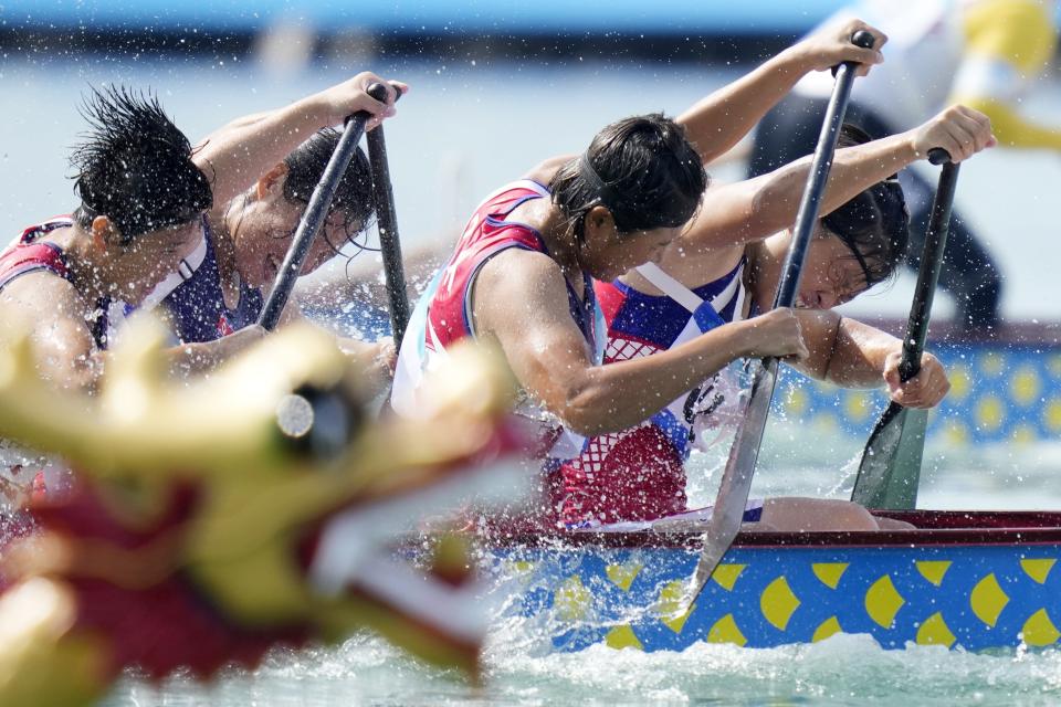 North Korea's women's dragon boat team compete in the Women's Dragon Boat 200m heat during the 19th Asian Games at the Wenzhou Dragon Boat Center in Wenzhou, China, Wednesday, Oct. 4, 2023. (AP Photo/Eugene Hoshiko)