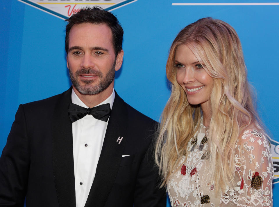 FILE - Jimmie Johnson and his wife Chandra Janway pose on the red carpet before the NASCAR Sprint Cup Series auto racing awards in Las Vegas, Dec. 2, 2016. Police in Muskogee, Okla., confirmed Tuesday, June 27, 2023, that they are investigating the deaths of three relatives of seven-time NASCAR champion Johnson as an apparent murder-suicide. A representative for Johnson confirmed the three are the parents and nephew of Johnson's wife, Chandra Janway. (AP Photo/John Locher, File)