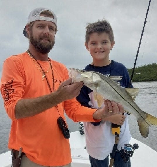 Capt. Jeff Patterson put 8-year-old Dalton Brinker on his first snook that he caught on his own.