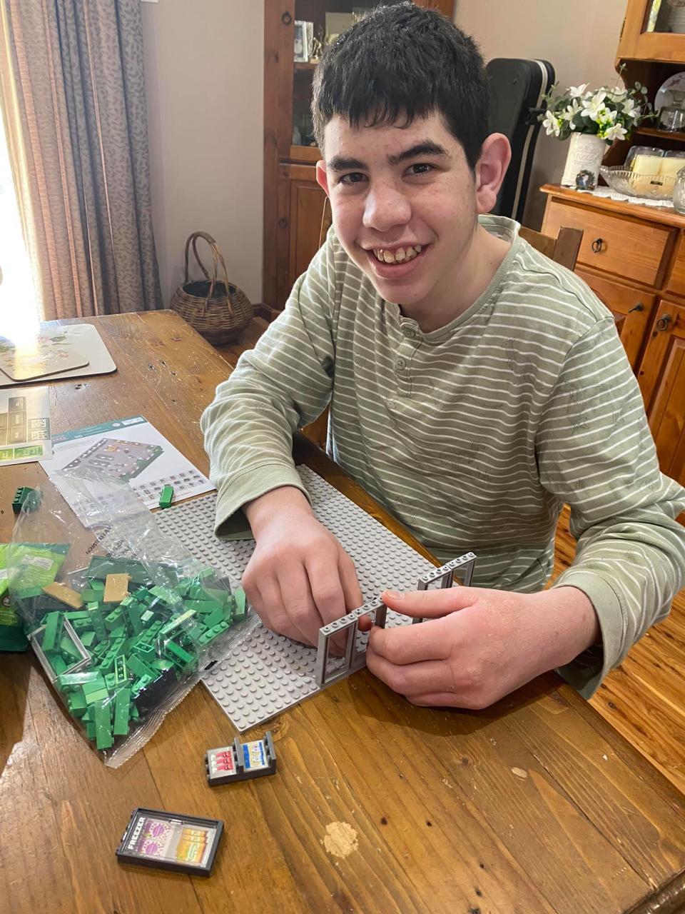 Photo of Aiden playing with Woolworths Bricks. Source: Facebook/Chrissy Cole