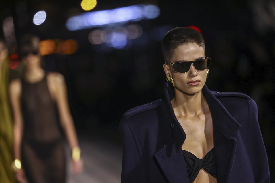 A model wears a creation for the Saint Laurent Spring/Summer 2023 fashion collection presented Tuesday, Sept. 27, 2022 in Paris. (Photo by Vianney Le Caer/Invision/AP)