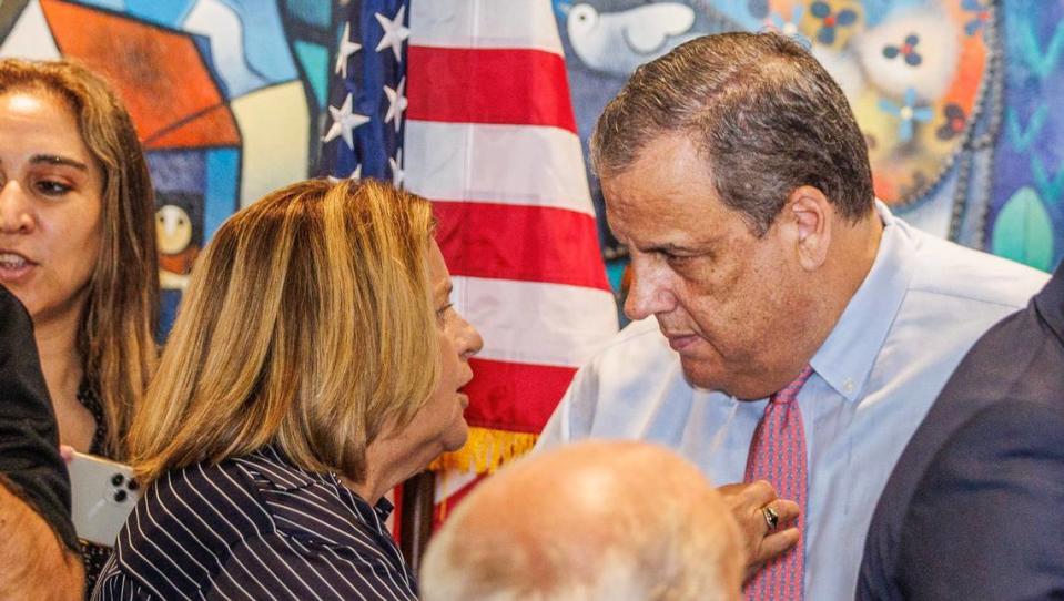 Republican presidential candidate Chris Christie chats with former Congresswoman Ileana Ros-Lehtinen during a town hall meeting at Casa Cuba restaurant in South Miami, on Friday, Aug.18, 2023.