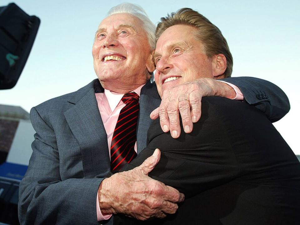 Kirk Douglas (L) and Michael Douglas in 2003 | Kevin Winter/Getty