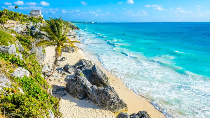 Mayan ruins of Tulum at tropical coast.