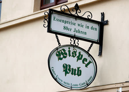 A sign which reads, "Food prices like in the 80s", is pictured at a restaurant in Quedlinburg, Germany, May 4, 2019. Picture taken May 4, 2019. REUTERS/Fabrizio Bensch