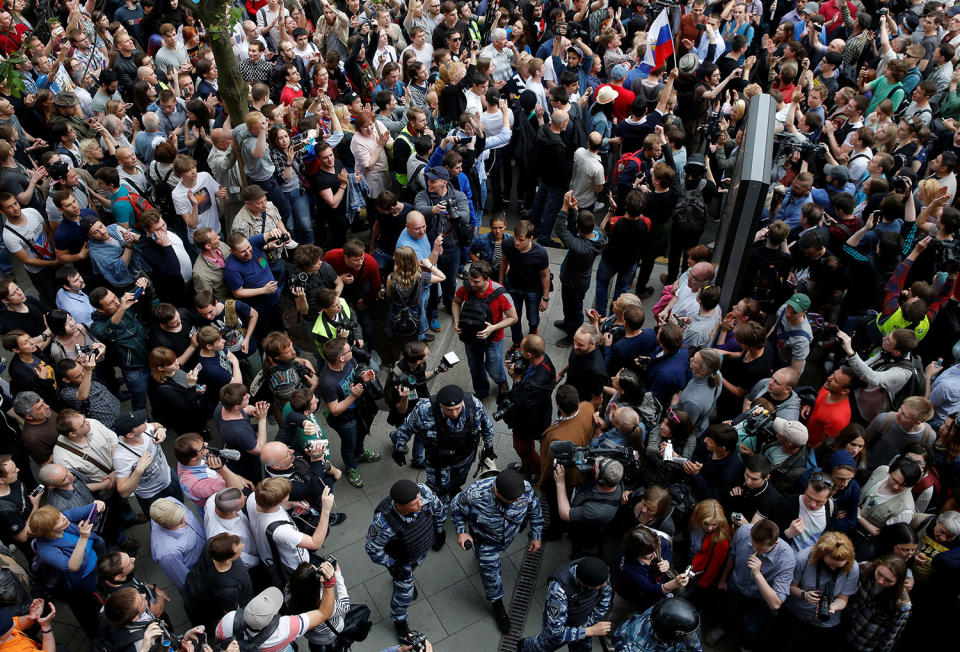 <p>Riot police pass demonstrators during an anti-corruption protest organised by opposition leader Alexei Navalny, on Tverskaya Street in central Moscow, Russia June 12, 2017. (Maxim Shemetov/Reuters) </p>