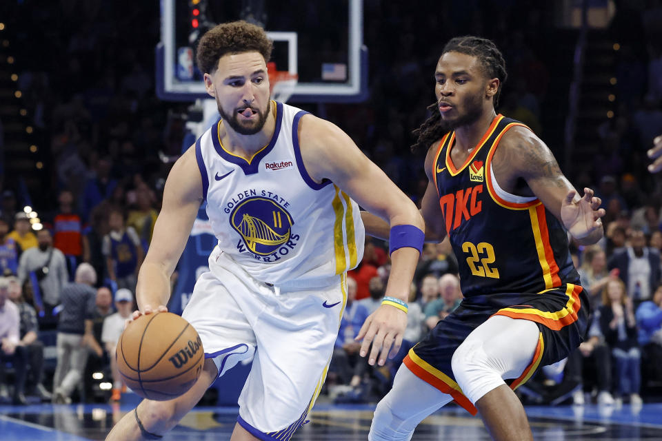 Nov 3, 2023; Oklahoma City, Oklahoma, USA; Golden State Warriors guard Klay Thompson (11) drives around Oklahoma City Thunder guard <a class="link " href="https://sports.yahoo.com/nba/players/10107" data-i13n="sec:content-canvas;subsec:anchor_text;elm:context_link" data-ylk="slk:Cason Wallace;sec:content-canvas;subsec:anchor_text;elm:context_link;itc:0">Cason Wallace</a> (22) during the second half at Paycom Center. Mandatory Credit: Alonzo Adams-USA TODAY Sports