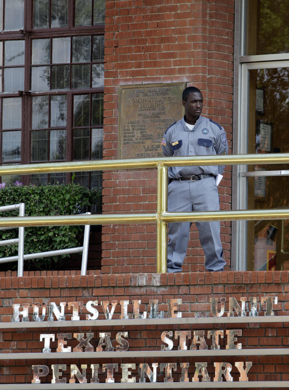 FILE - In this Sept. 21, 2011, file photo, a corrections officer keeps watch outside the Texas Department of Criminal Justice Huntsville Unit in Huntsville, Texas. On Tuesday, April 1, 2014, two days before Texas is scheduled to execute convicted killer Ramiro Hernandez-Llanas, its first inmate with a new batch of lethal injection drugs obtained last month, the state prison agency again is seeking to keep the source of the drugs secret, citing threats of violence to pharmacies that sell drugs used in lethal injections. (AP Photo/David J. Phillip, File)