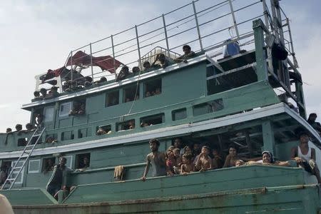 Hundreds of migrants are seen on a boat drifting 17 km (10 miles) off the coast of the southern island of Koh Lipe May 14, 2015. Thailand has found a boat drifting off its west coast carrying 300 migrants but has refused to grant it permission to land, a senior police officer said on Thursday. REUTERS/Stringer