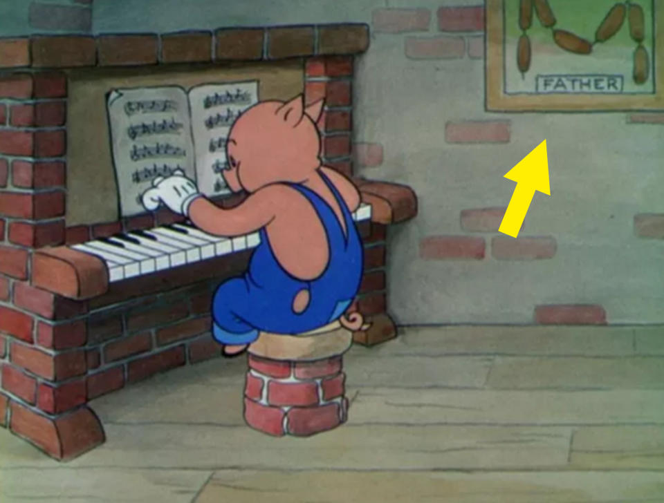 A pig plays the piano and in the background, a photograph of sausages labeled "father" hangs on the wall