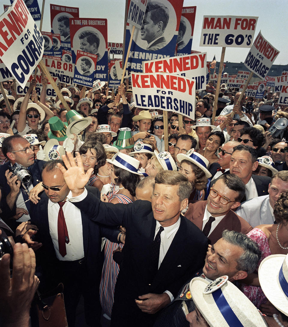 JFK waving to supporters