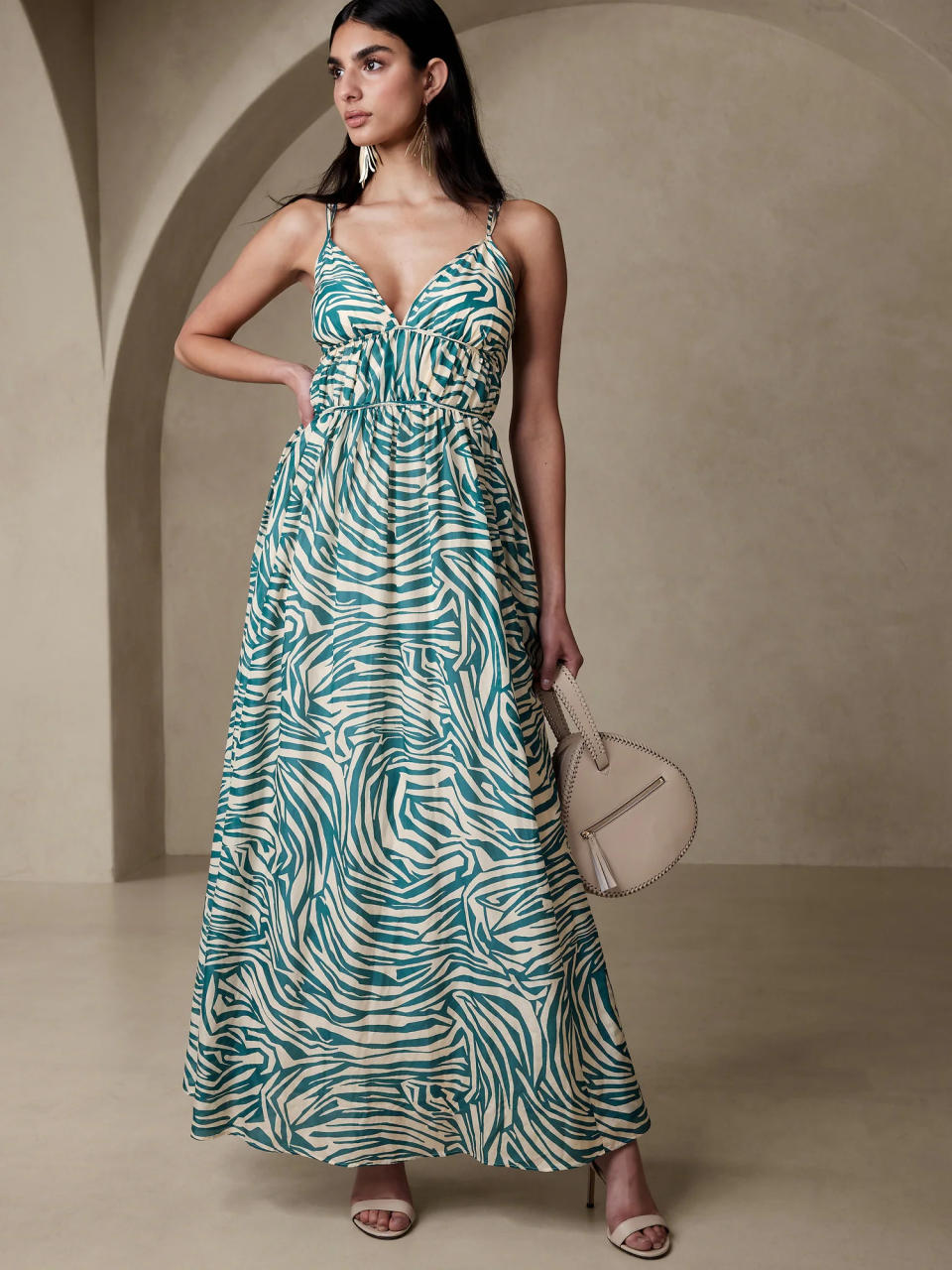 woman wears zebra print banana republic Rosalia Cotton-Silk Maxi Dress. 