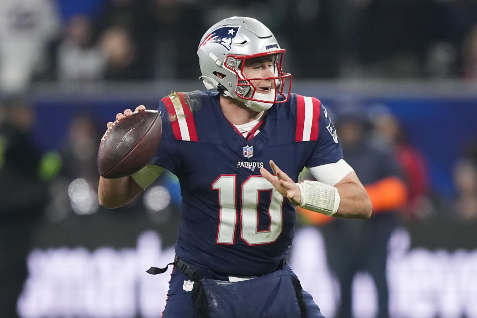 New England Patriots quarterback Mac Jones (10) drops back to pass in the second half of an NFL football game against the Indianapolis Colts in Frankfurt, Germany Sunday, Nov. 12, 2023. (AP Photo/Martin Meissner)