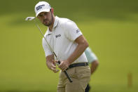 Patrick Cantlay putts on the 13th hole during a practice round for the PGA Championship golf tournament, Tuesday, May 17, 2022, in Tulsa, Okla. (AP Photo/Sue Ogrocki)