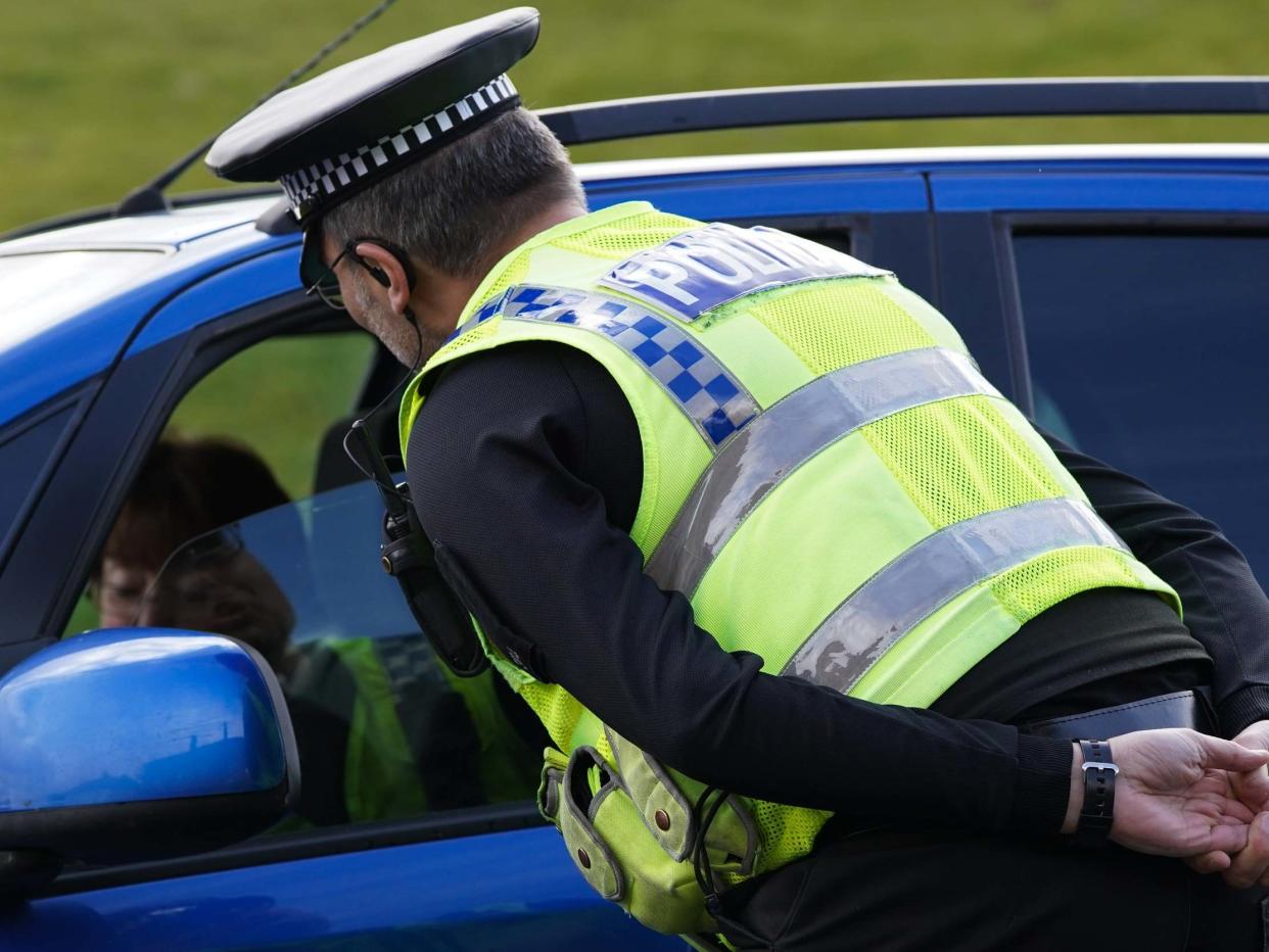 North Yorkshire Police officer reinforces the importance of social distancing and staying at home at a vehicle stop: Getty