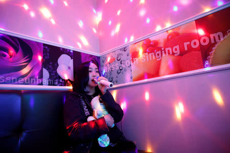 Japanese Yuuka Hasumi, 17, who wants to become a K-pop star, sings a song as she spends time after class, in the Hongdae area of Seoul, South Korea, April 3, 2019. REUTERS/Kim Hong-Ji