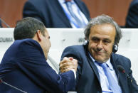 UEFA President Michel Platini (R) and Prince Ali bin Al Hussein of Jordan, FIFA presidential candidate, do a Handshake For Peace at the 65th FIFA Congress in Zurich, Switzerland, May 29, 2015. REUTERS/Arnd Wiegmann