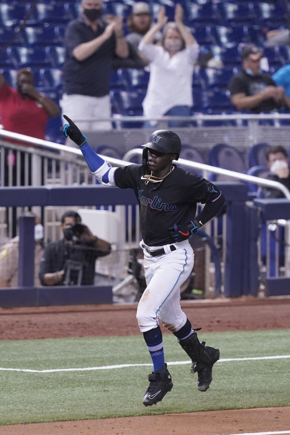 Miami Marlins' Jazz Chisholm Jr. gestures after hitting a home run during the fifth inning of a baseball game against the San Francisco Giants, Friday, April 16, 2021, in Miami. (AP Photo/Marta Lavandier)