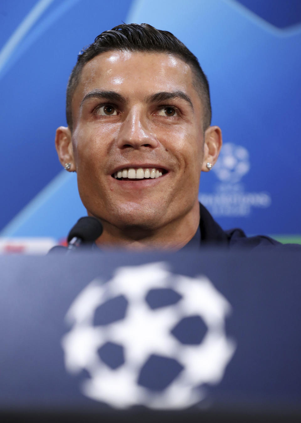 Juventus' Cristiano Ronaldo attends a press conference at Old Trafford, Manchester, England, Monday, Oct. 22, 2018. Juventus will play a Champions League soccer match against Manchester United on Tuesday. (Martin Rickett/PA via AP)