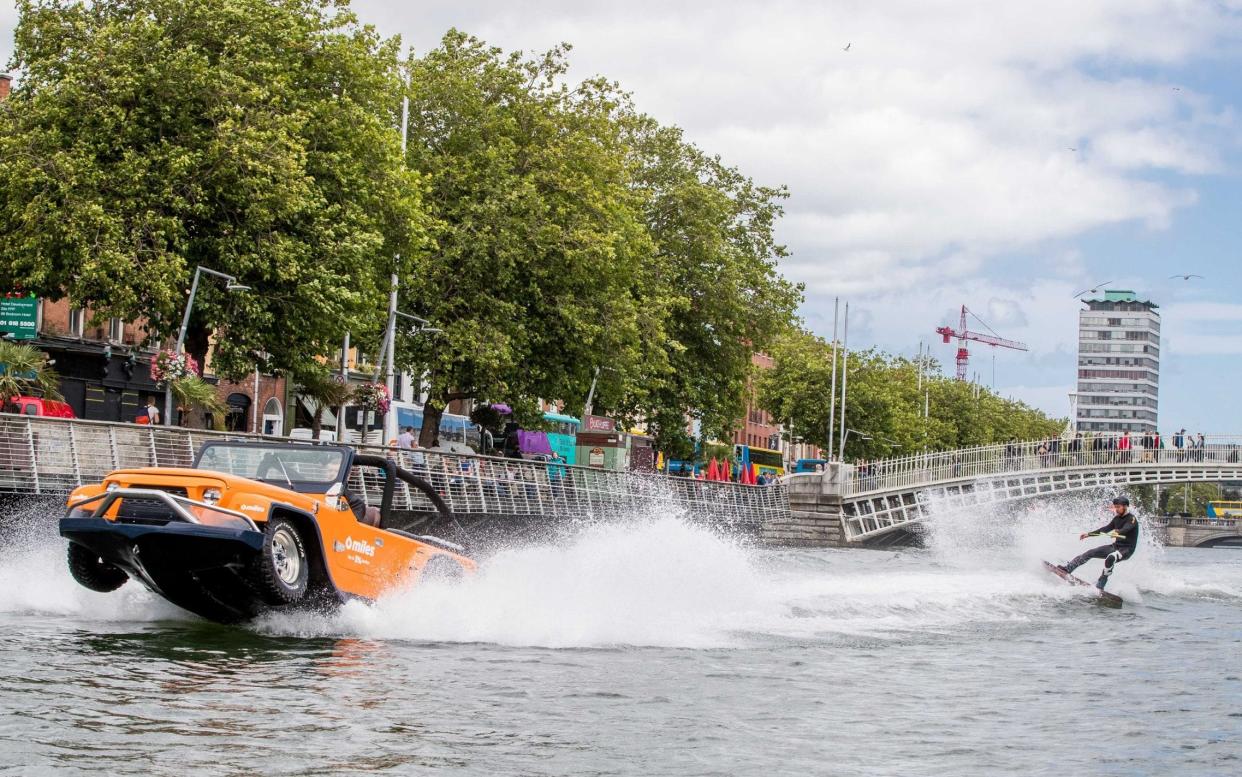 The WaterCar on the Liffey in Dublin, with champion wakeboarder in tow