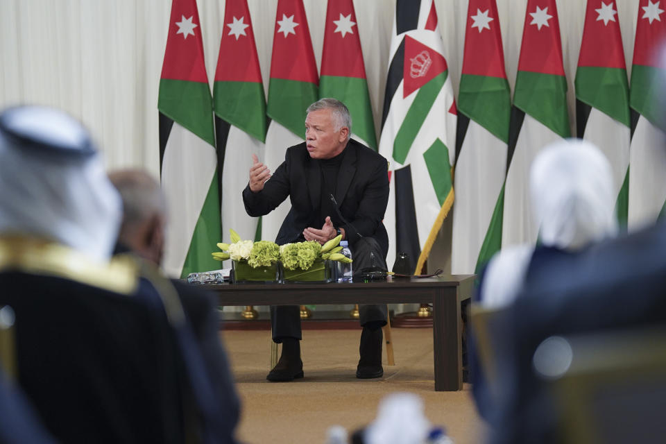 FILE - In this Oct. 4, 2021 file photo, Jordan's King Abdullah II speaks during a meeting with tribal leader in Al-Qasta, south of Amman, Jordan. A years-long economic downturn, accelerated by the coronavirus pandemic, means more than half of young Jordanians are now unemployed and the country is sinking deeper into debt. Recent revelations that King Abdullah II secretly amassed more than $106 million in luxury properties abroad have further undermined public trust. (Yousef Allan/The Royal Hashemite Court via AP, File)