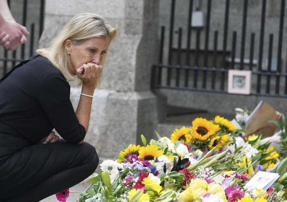 Sophie, Countess of Wessex views the messages and floral tributes left by members of the public following the death of Queen Elizabeth II on Thursday, at Balmoral, Scotland, Saturday, Sept. 10, 2022. (Owen Humphreys/Pool Photo via AP)