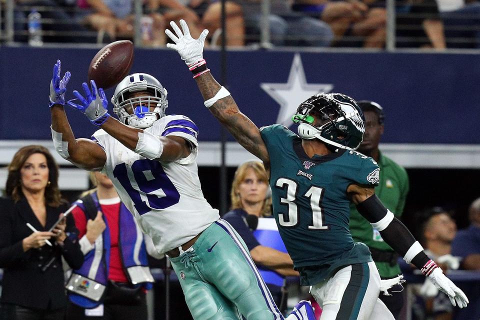 Amari Cooper (19) of the Dallas Cowboys catches a pass against Jalen Mills (31) of the Philadelphia Eagles in the fourth quarter at AT&T Stadium in Arlington, Texas, on Sunday, Oct. 20, 2019.