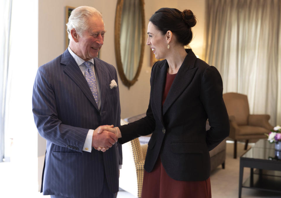 Britain's Prince Charles shakes hands with New Zealand Prime Minister Jacinda Ardern at Government House in Auckland, New Zealand, Tuesday, Nov. 19, 2019. Prince Charles and his wife Camilla are on a weeklong trip, during which they plan to visit the city of Christchurch and the historic treaty grounds at Waitangi, where the nation's founding document was signed. (Patrice Allen/Pool Photo via AP)