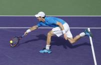Andy Murray, of Britain, returns the ball to Novak Djokovic, of Serbia, at the Sony Open Tennis tournament in Key Biscayne, Fla., Wednesday, March 26, 2014. Djokovic defeated Murray 7-5, 6-3. (AP Photo/Joel Auerbach)