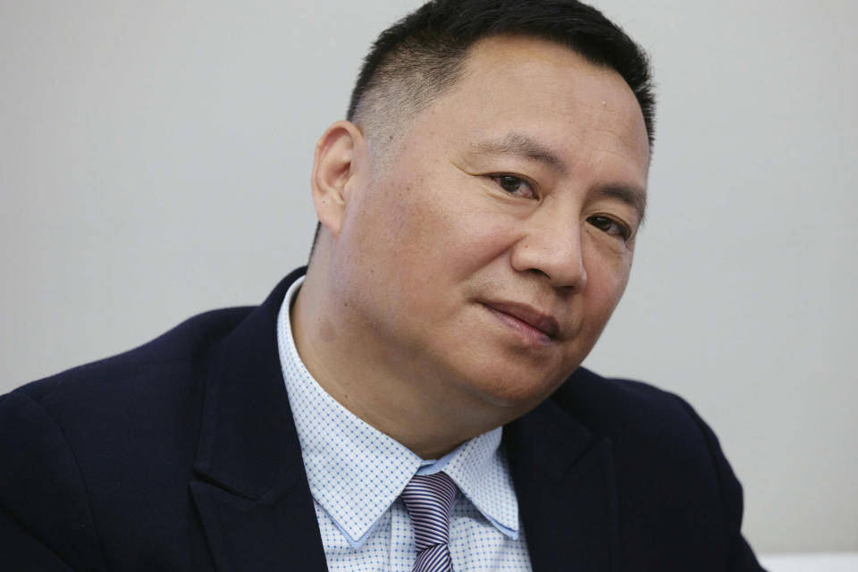 A member of the June 4 Massacre Memorial Association committee and founder Wang Dan, also known as Dan Wang, listens to a question during a press conference at the June 4th Memorial Exhibit on Thursday, June 1, 2023, in New York. The exhibit will open Friday, June 2, 2023, in New York, ahead of the June 4 anniversary of the violence that ended China's 1989 Tiananmen protests. (AP Photo/Andres Kudacki).