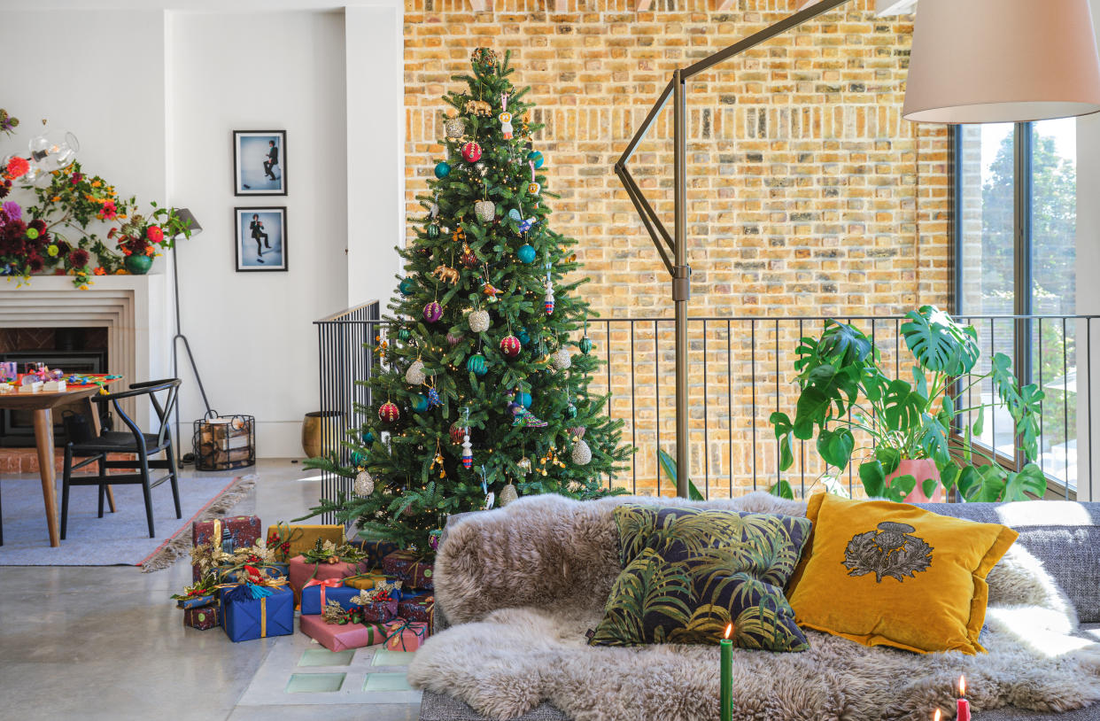  A colorful christmas tree in a modern home. 