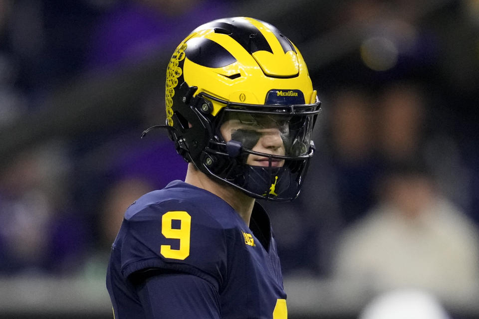 Michigan quarterback J.J. McCarthy watches during warm ups before the national championship NCAA College Football Playoff game between Washington and Michigan Monday, Jan. 8, 2024, in Houston. (AP Photo/Godofredo A. Vasquez)