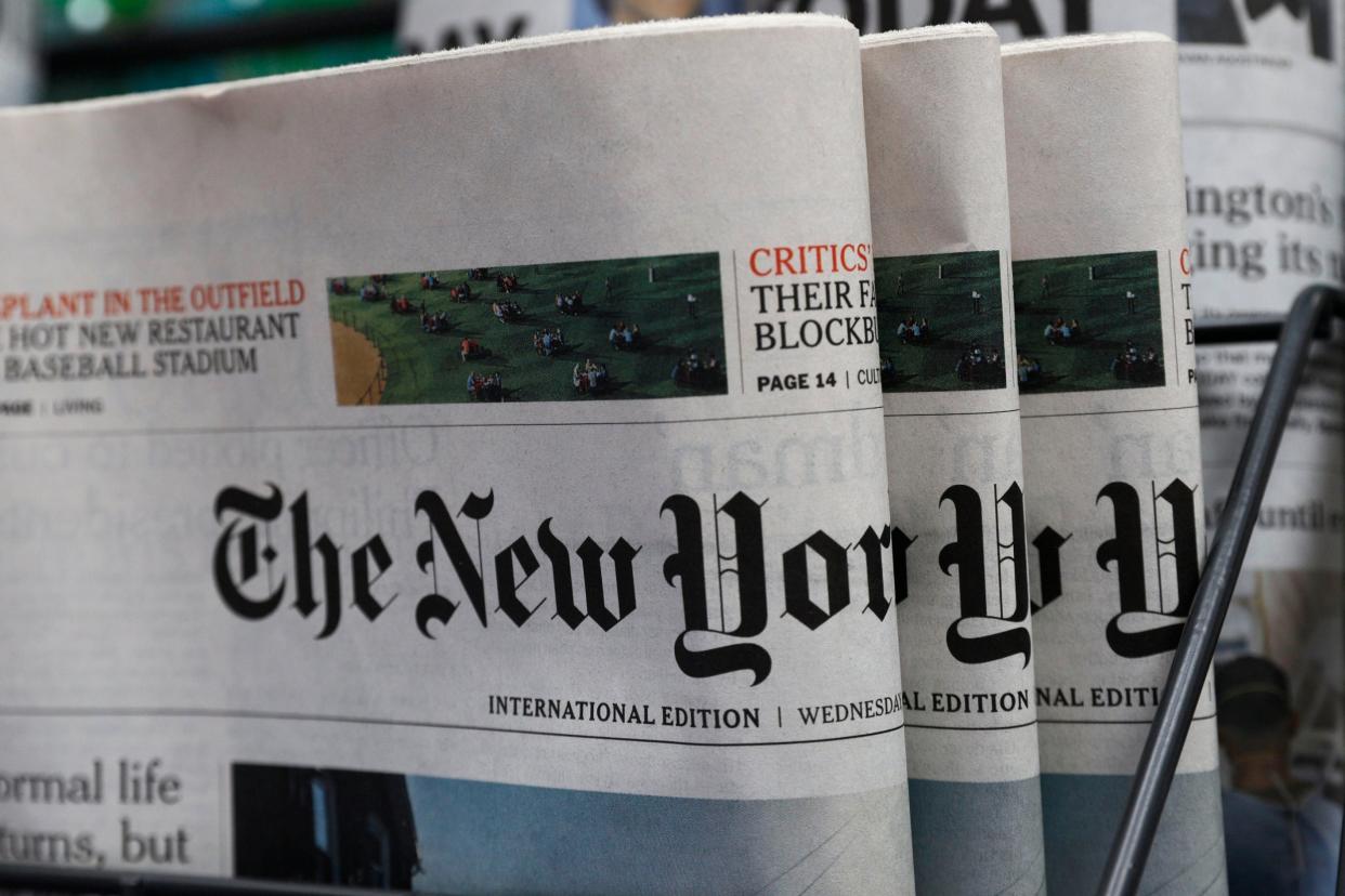 Copies of the New York Times are seen on sale at a news stand in Hong Kong on Wednesday. The paper said it would transfer some of its staff out of the city because of the uncertainties around the new national security law: AP