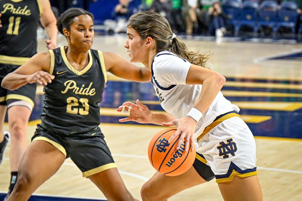 Notre Dame Fighting Irish guard Sonia Citron (11) drives to the basket as Purdue Northwest’s Kennedy Jackson (23) defends in the first half Monday, Oct. 30, 2023, at the Purcell Pavilion.