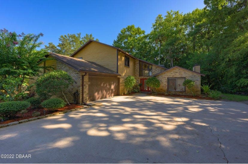 This incredible riverfront property in Ormond Beach's Tomoka Oaks features four bedrooms, a downstairs bonus room and an additional office along with three-and-a-half bathrooms.