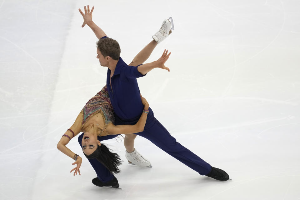 United States' Madison Chock and Evan Bates compete during the Ice Dance Rhythm Dance at the figure skating Grand Prix finals at the Palavela ice arena, in Turin, Italy, Friday, Dec. 9, 2022. (AP Photo/Antonio Calanni)
