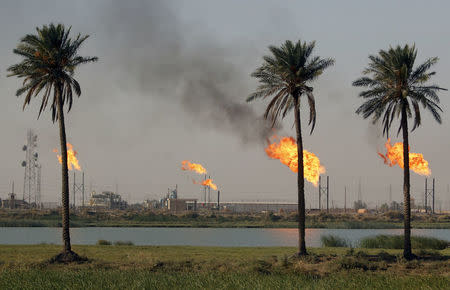 Flames emerge from a pipeline at the oil fields in Basra, southeast of Baghdad, Iraq October 14, 2016. REUTERS/Essam Al-Sudani/File Photo