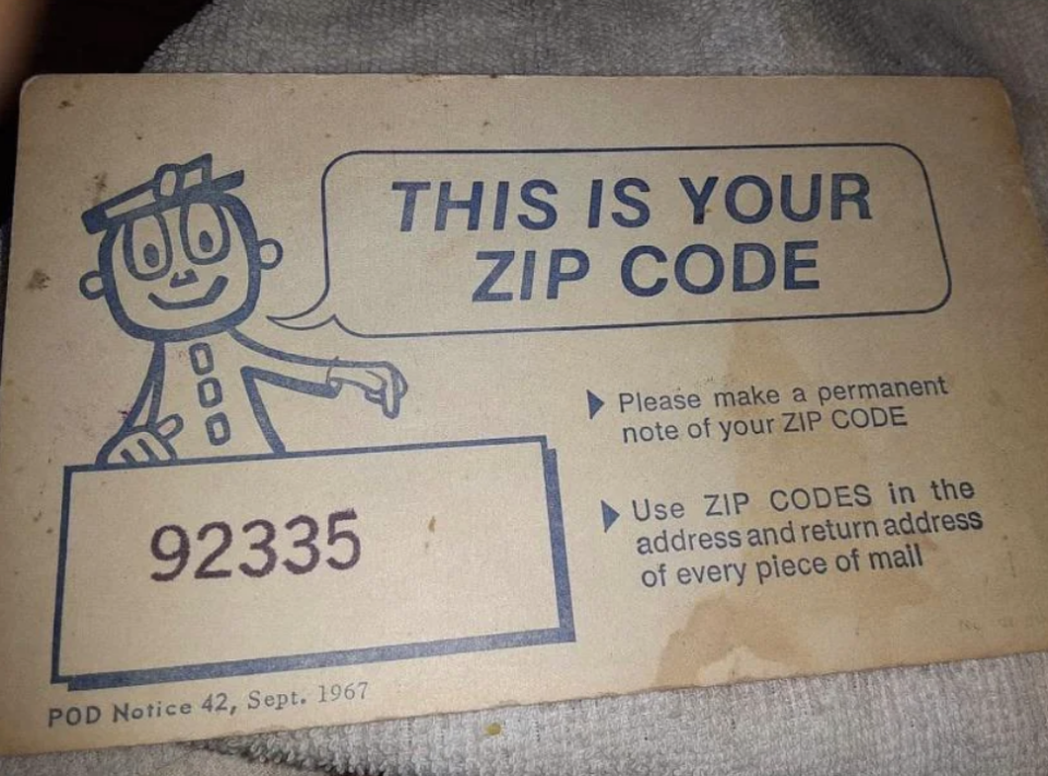 Illustration of a cartoon character next to "This is your ZIP CODE" with a sample code "92335" on a postal notification card