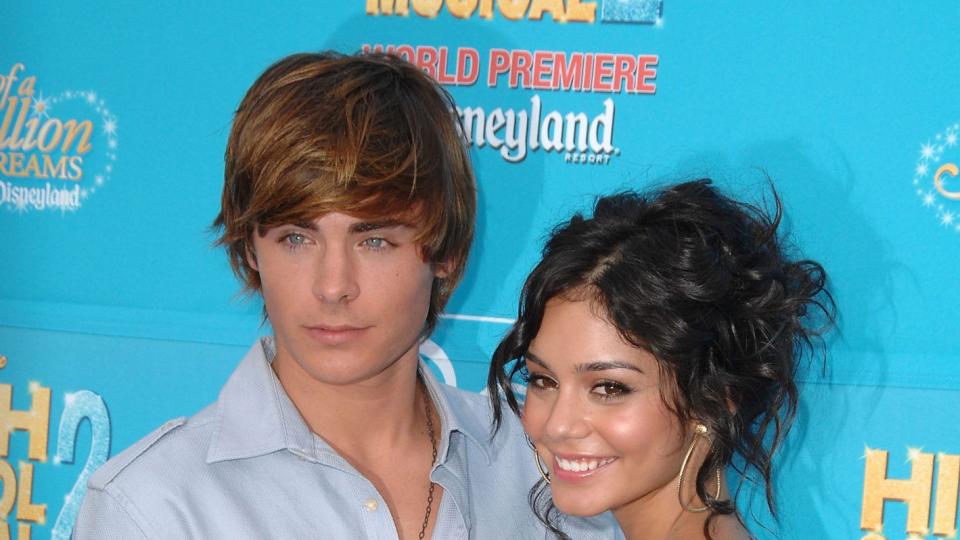 Zac Efron and Vanessa Hudgens smiling together for a Disney premiere