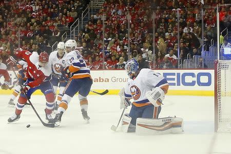 Jan 18, 2019; Washington, DC, USA; New York Islanders goaltender Thomas Greiss (1) makes a save on Washington Capitals left wing Jakub Vrana (13) in the second period at Capital One Arena. Mandatory Credit: Geoff Burke-USA TODAY Sports