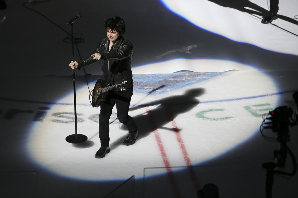 Green Day lead singer Billie Joe Armstrong performs between NHL hockey All Star games Saturday, Jan. 25, 2020, in St. Louis. (AP Photo/Scott Kane)