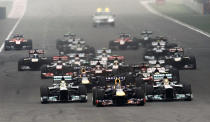Red Bull Formula One driver Sebastian Vettel of Germany leads the field at the start of the Indian F1 Grand Prix at the Buddh International Circuit in Greater Noida, on the outskirts of New Delhi, October 27, 2013. REUTERS/Adnan Abidi (INDIA - Tags: SPORT MOTORSPORT F1)