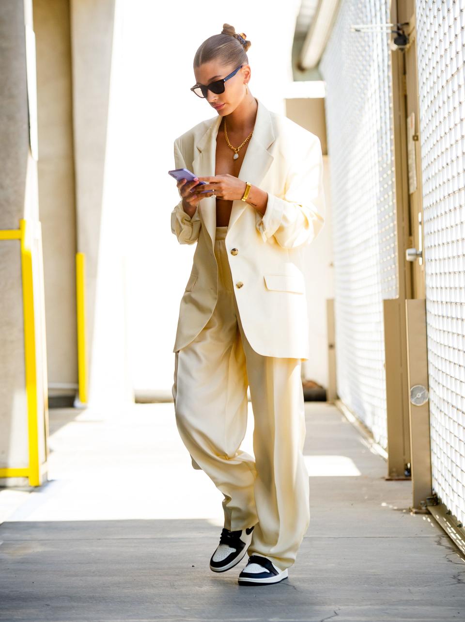 <p>The supermodel paired an oversized Magda Butrym suit with Nike Air Jordans and <a href="https://www.monicavinader.com/" rel="nofollow noopener" target="_blank" data-ylk="slk:Monica Vinader jewellery;elm:context_link;itc:0;sec:content-canvas" class="link ">Monica Vinader jewellery</a> while out in Los Angeles. Bieber glowed after her holidays abroad, eschewing a shirt to show off that tan. </p><p><a class="link " href="https://www.luisaviaroma.com/en-gb/p/magda-butrym/women/74I-RSH065" rel="nofollow noopener" target="_blank" data-ylk="slk:SHOP HAILEY'S JACKET NOW;elm:context_link;itc:0;sec:content-canvas">SHOP HAILEY'S JACKET NOW</a></p>