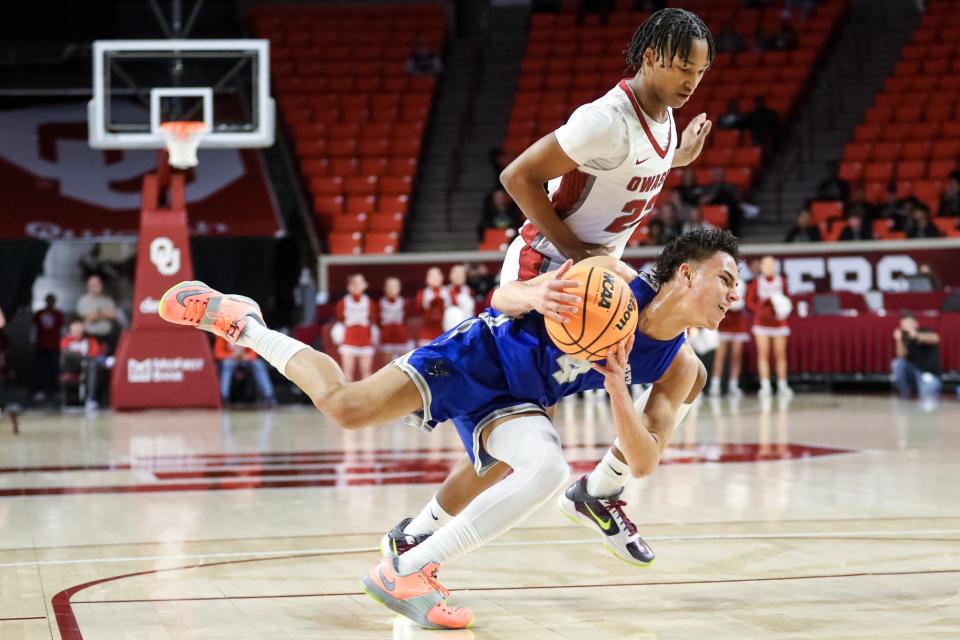 Deer Creek’s Clyde Davis Jr. (4) dives for the ball during a boys high school basketball quarterfinals game in the state tournament between Owasso and Deer Creek at the Lloyd Noble Center in Norman, Okla., on Thursday, March 9, 2023. 