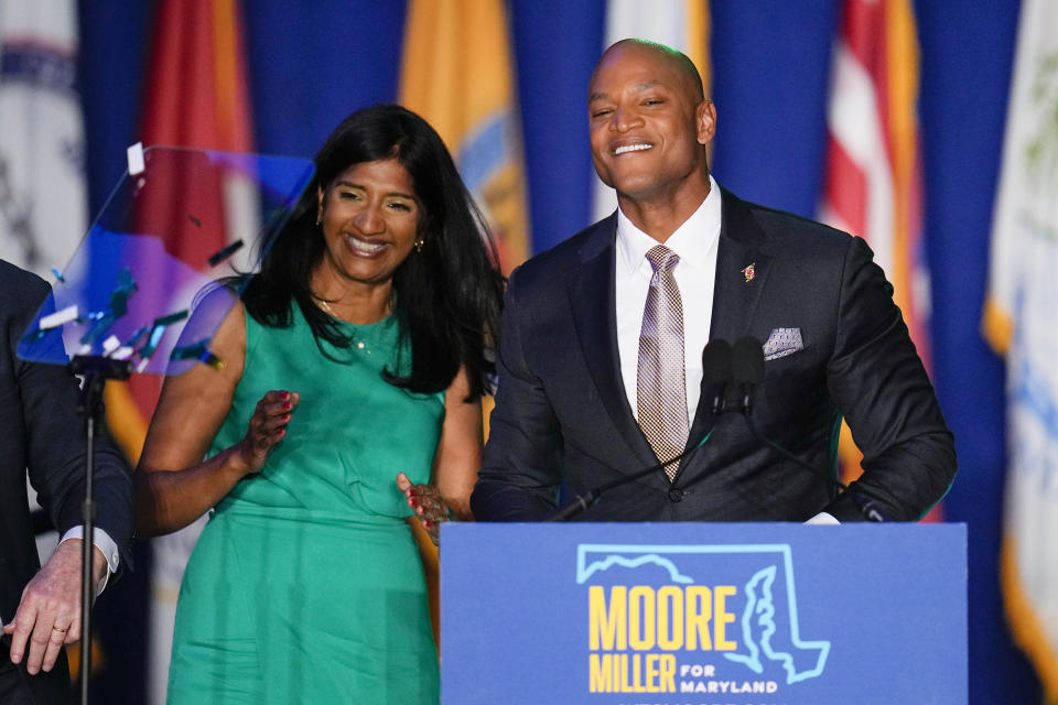 Democrats Aruna Miller, left, and Wes Moore react during an election night gathering after Miller was declared the winner in the race for the Maryland lieutenant governor and Moore was declared the winner in the gubernatorial race, Tuesday, Nov. 8, 2022, in Baltimore. (AP Photo/Julio Cortez)