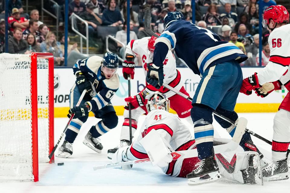 Apr 16, 2024; Columbus, Ohio, USA; Columbus Blue Jackets left wing James Malatesta (67) scores past Carolina Hurricanes goaltender Spencer Martin (41) during the first period of the NHL hockey game at Nationwide Arena.